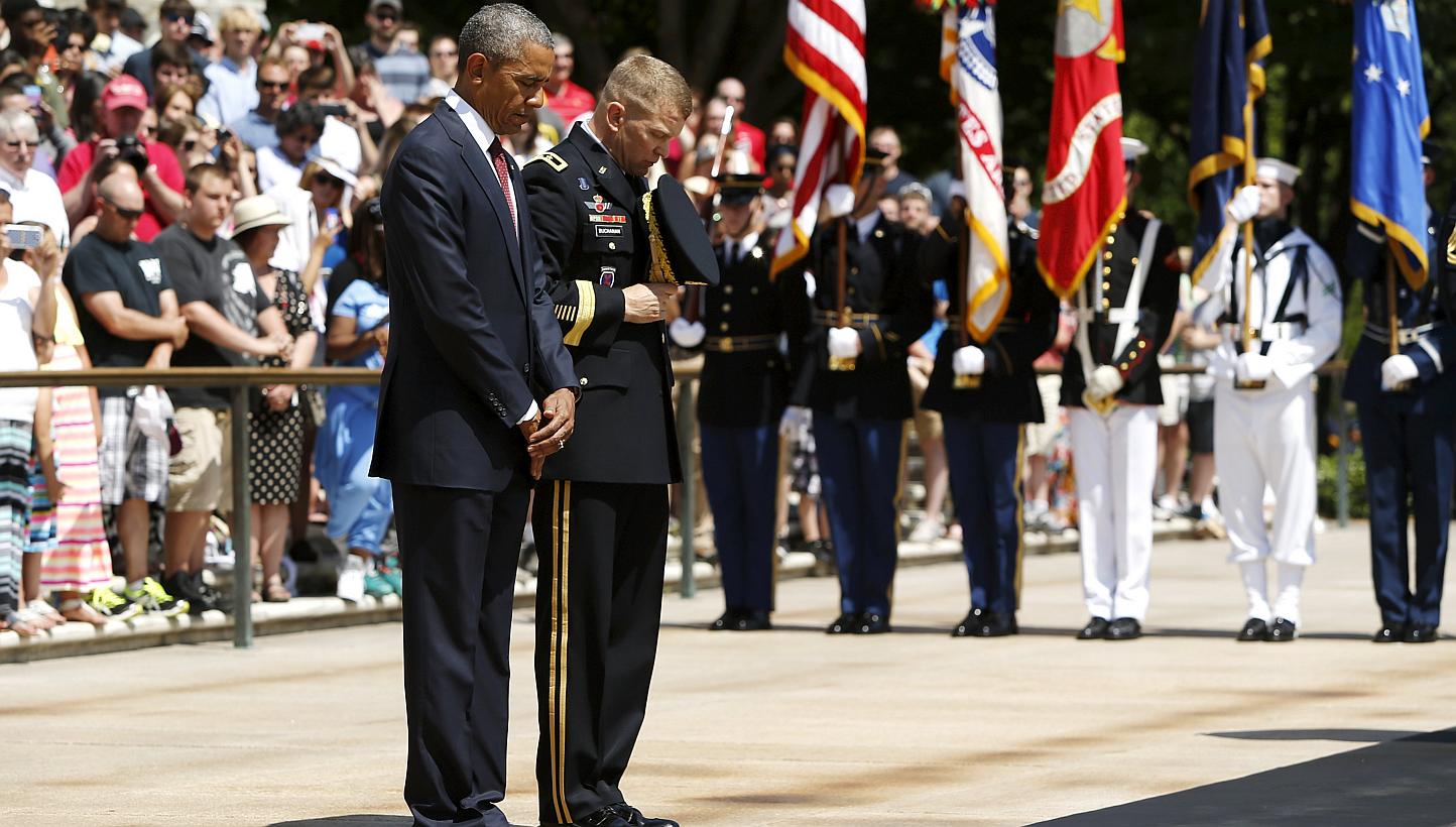 U.S. President Barack Obama (left) and U.S. Army Military District of Washington Commanding General Jeffrey Buchanan participate in the wreath-laying ceremony at the Tomb of the Unknown Soldier as part of the Memorial Day observance at Arlington Nati