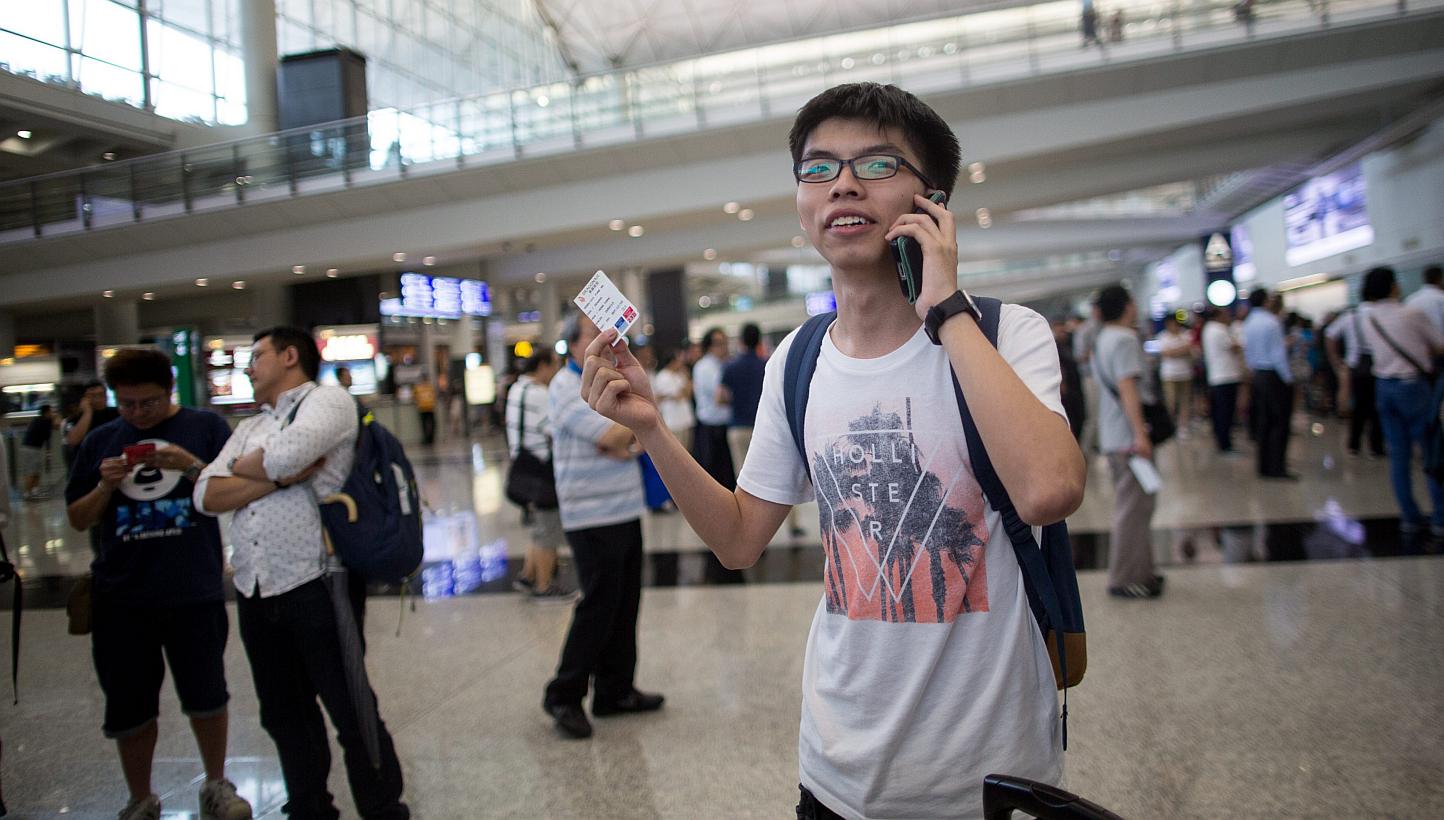 Student leader of the Occupy protests Joshua Wong arrives at the Hong Kong International Airport in Hong Kong, China, on May 26, 2015. -- PHOTO: EPA 