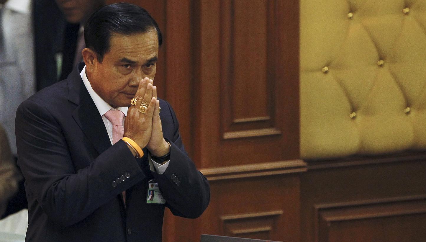 Thailand's Prime Minister Prayuth Chan-o-cha gestures in a traditional greeting to National Legislative Assembly members at the parliament in Bangkok, Thailand, on May 21, 2015. -- PHOTO: REUTERS
