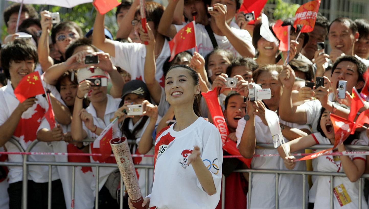 A file photo of Chinese actress Huang Shengyi at the first mainland leg of the Olympic torch relay in 2008. The actress reportedly had a son with her agent Yang Zi. -- PHOTO: ST FILE&nbsp;