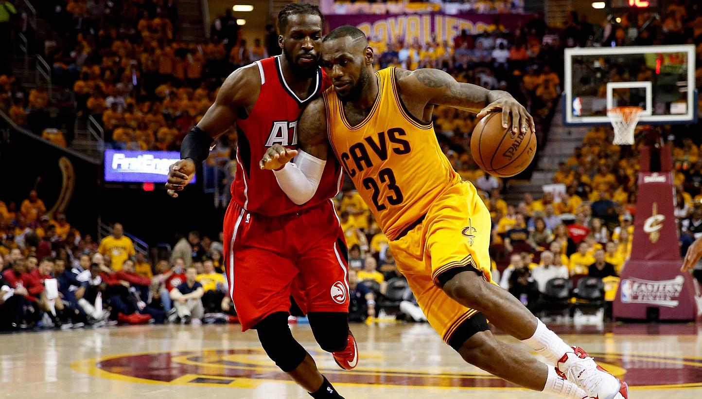 LeBron James (right) of the Cleveland Cavaliers drives with the ball against DeMarre Carroll (left) of the Atlanta Hawks in the third quarter during Game Four of the Eastern Conference Finals of the 2015 NBA Playoffs at Quicken Loans Arena on May 26,