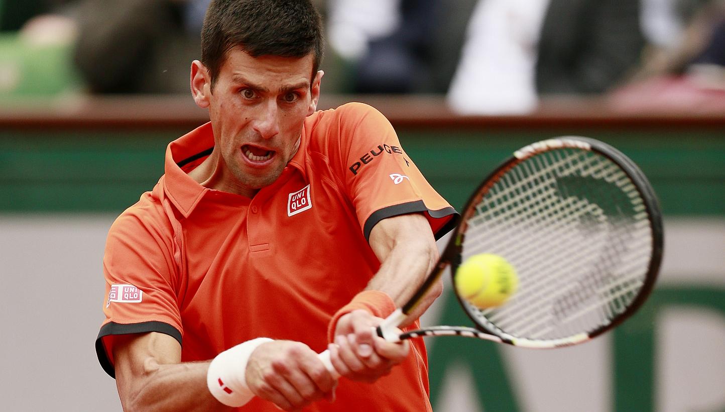Serbia's Novak Djokovic in action during the first round of the French Open at&nbsp;Roland Garros in Paris. -- PHOTO: REUTERS