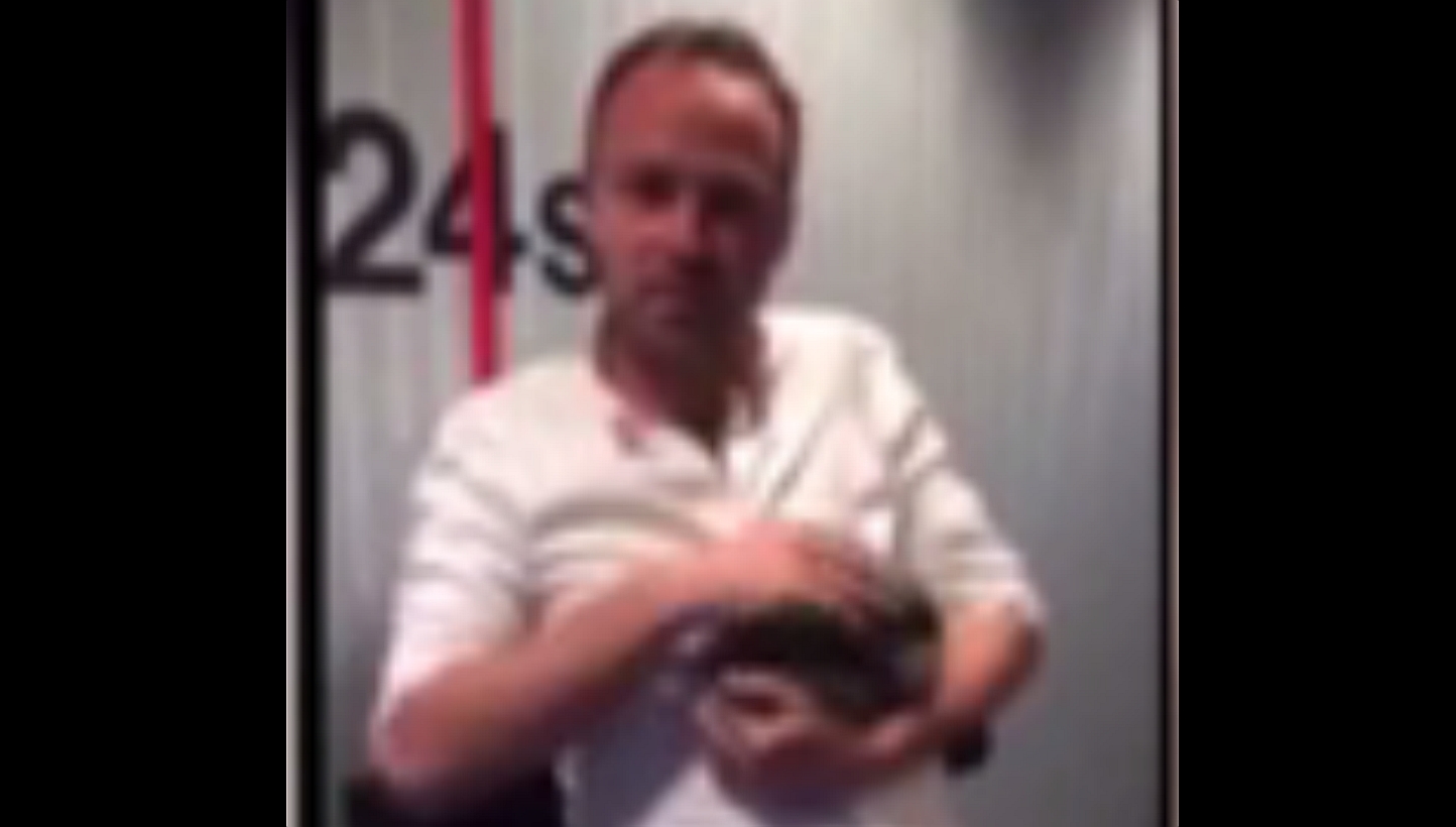 Danish radio host Asger Juhl cradles baby rabbit Allan before beating him to death with a bicycle pump on his show. -- PHOTO: YOUTUBE