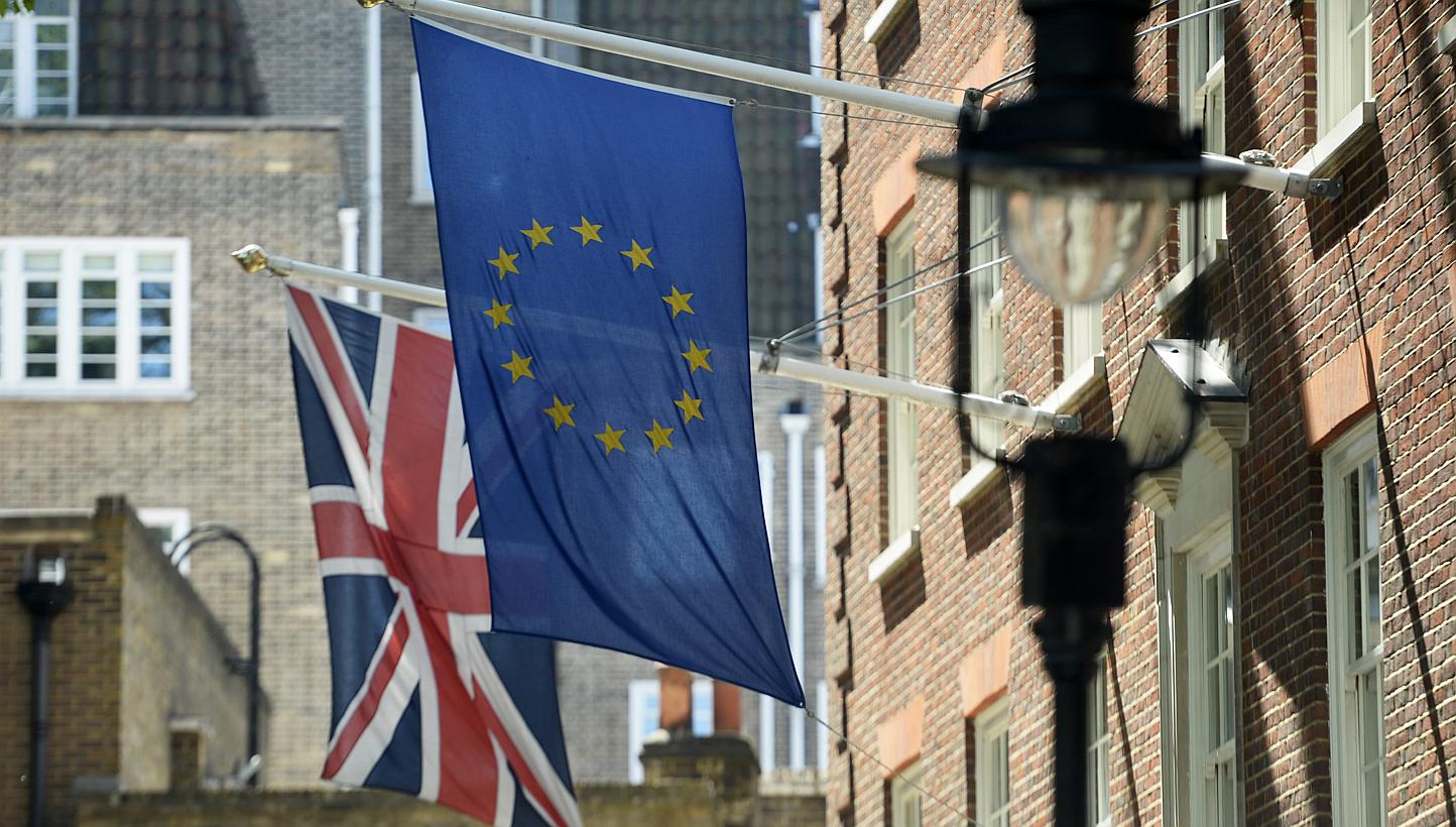 The Union Flag (left) next to the EU flag (right) near Westminster in London, Britain, on May 26, 2015.&nbsp;Voters will be asked "Should the United Kingdom remain a member of the European Union?" in a referendum to be held by 2017, the British gover