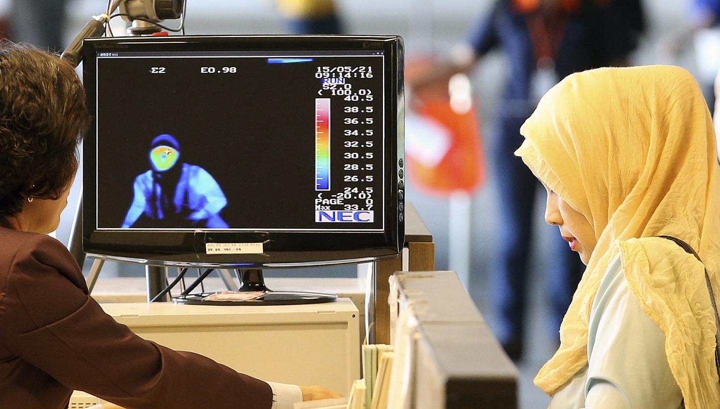Passengers from the Middle East passing by a thermal camera at Incheon airport, west of Seoul, South Korea, on May 21, 2015. -- PHOTO: EPA