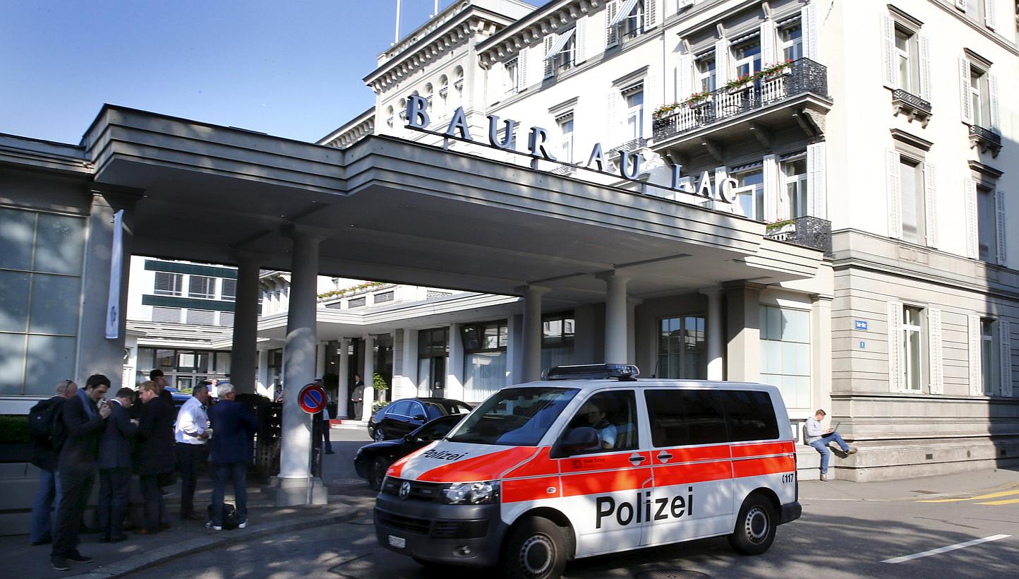 A police van drives past the Baur au Lac hotel in Zurich yesterday, when seven Fifa officials were arrested and detained pending extradition to the United States. The early-morning raids related to suspected corruption within soccer's governing body,