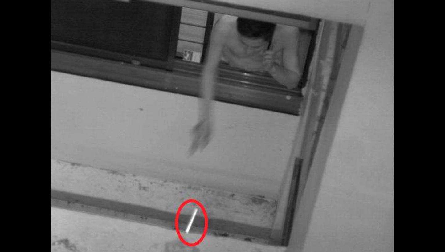 A man caught on camera throwing a cigarette butt out of the window at his home in Sengkang in January this year. According to tender documents, the new cameras will be deployed temporarily to monitor certain flats.