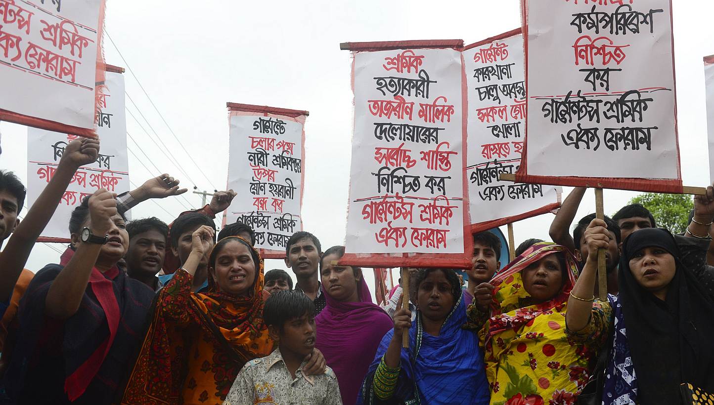 Memebers of the Bangladeshi garments worker union shout slogans as they mark the second anniversary of the Rana Plaza building collapse at the site where the building once stood in Savar, on the outskirts of Dhaka, on April 24, 2015.&nbsp;Two garment