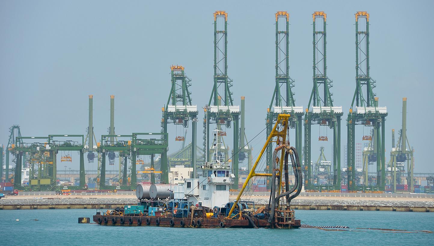 Future maritime trade routes such as Artic shipping lanes could challenge Singapore's position as a global shipping hub, but boosting efficiency and capacity will help the Republic's port stay competitive and relevant.&nbsp;-- PHOTO: ST FILE