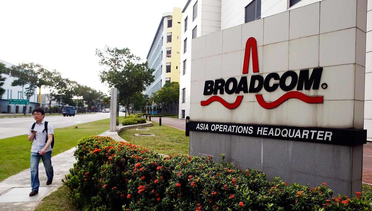 A man passes Broadcom's Asia operations headquarters office at an industrial park in Singapore. -- PHOTO: REUTERS