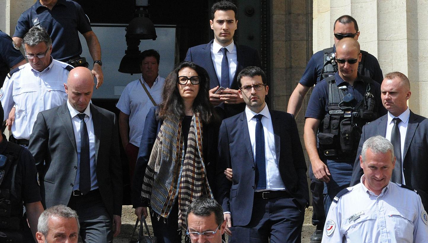 Francoise Bettencourt-Meyers (centre), daughter of France's richest woman Liliane Bettencourt, flanked by her sons Nicolas (at her left) and Jean-Victor (centre,background), leaves on May 28, 2015, the Bordeaux courthouse, south-western France, after