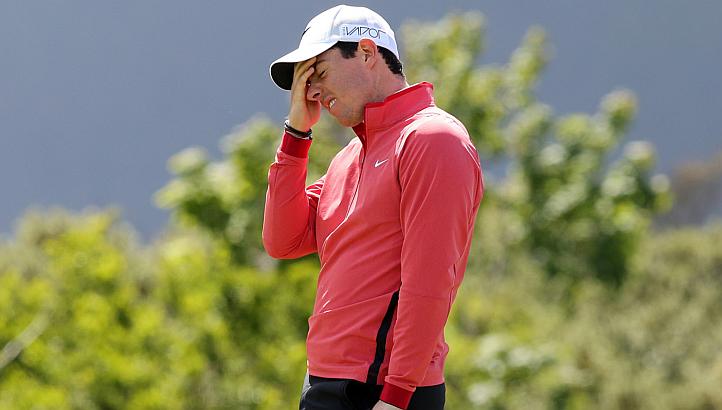 Rory McIlroy reacting after missing his putt shot on the 9th green on the first day of the Irish Open at the Royal County Down Golf Club in Newcastle in Northern Ireland on May 28, 2015. -- PHOTO: AFP 