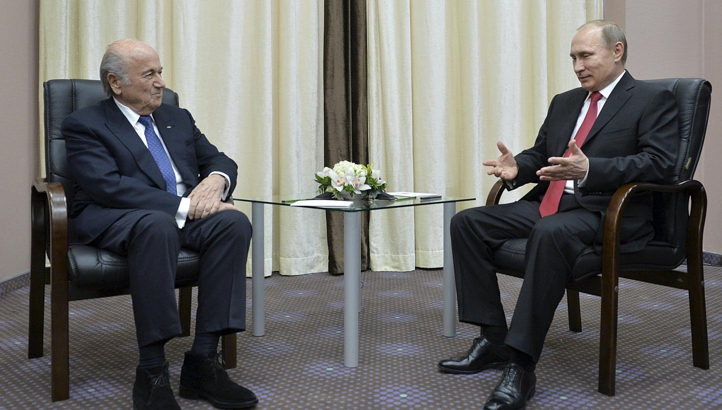 Russian President Vladimir Putin (right) meets with Fifa president Sepp Blatter in Sochi, on April 20, 2015. US diplomats avoided a clash of words Thursday with Moscow on the corruption scandal shaking Fifa after Mr Putin accused Washington of trying