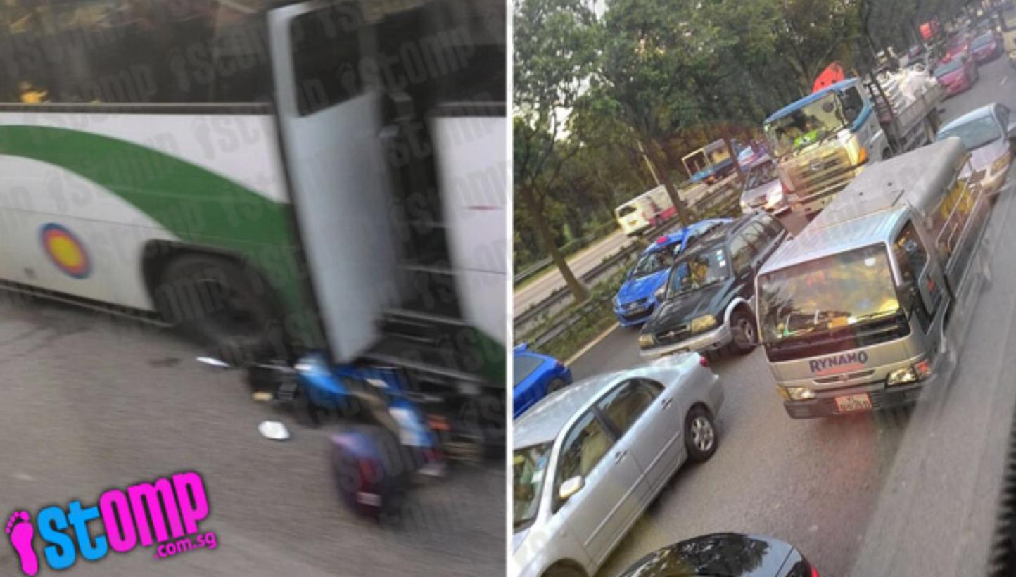 A motorcycle was crushed under a bus in an accident involving a motorcycle, a bus and a lorry on the AYE on Friday morning. -- PHOTO: STOMP