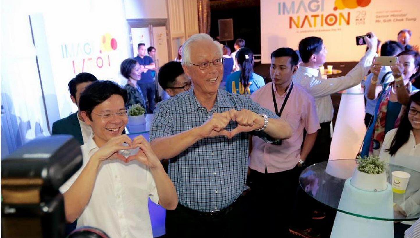 Emeritus Senior Minister Goh Chok Tong (centre) and Minister Lawrence Wong at the launch of ImagiNation - an exhibition at *Scape created in celebration of Kindness Day SG on May 29, 2015. -- PHOTO: SINGAPORE KINDNESS MOVEMENT