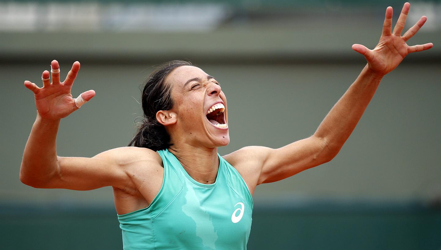 Francesca Schiavone of Italy celebrating after winning the second round match. -- PHOTO: EPA