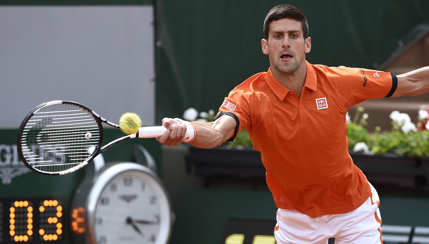 Serbia's Novak Djokovic returns the ball to Luxemburg's Gilles Muller during the men's second round at the Roland Garros 2015 French Tennis Open in Paris on May 28, 2015. -- PHOTO: AFP