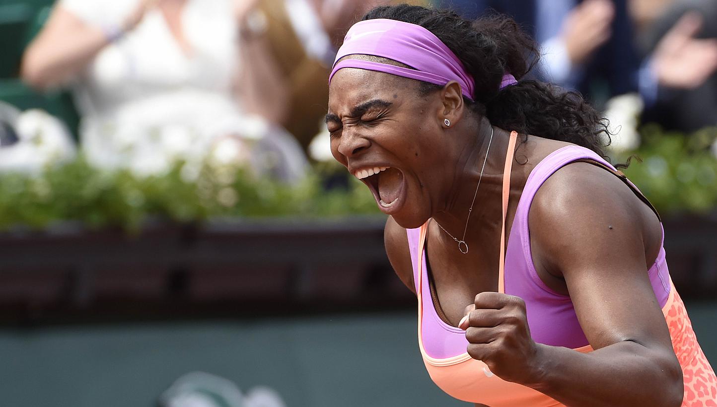 US player Serena Williams celebrating after winning her match against Germany's Anna-Lena Friedsam during the women's second round of the Roland Garros 2015 French Tennis Open in Paris on May 28, 2015. Williams won the match 5-7, 6-3, 6-3. -- PHOTO: 