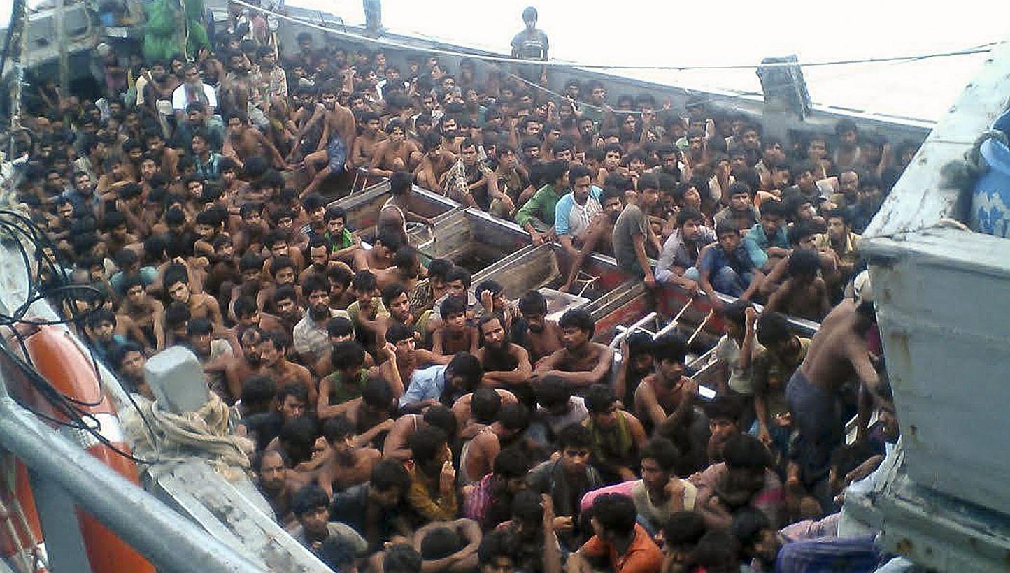 A handout picture released by the Myanmar Ministry of Information on May 30,&nbsp;2015, shows migrants who were seized by the Myanmar navy in a boat near the Irrawaddy delta on May 29,&nbsp;2015. Myanmar's navy refused on Sunday, May 31, to let journ