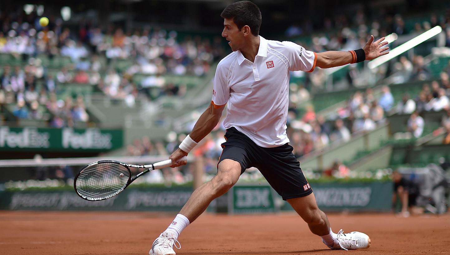 Serbia's Novak Djokovic returns the ball to Australia's Thanasi Kokkinakis during the men's third round at the Roland Garros 2015 French Tennis Open in Paris on May 30, 2015. -- PHOTO: AFP&nbsp;