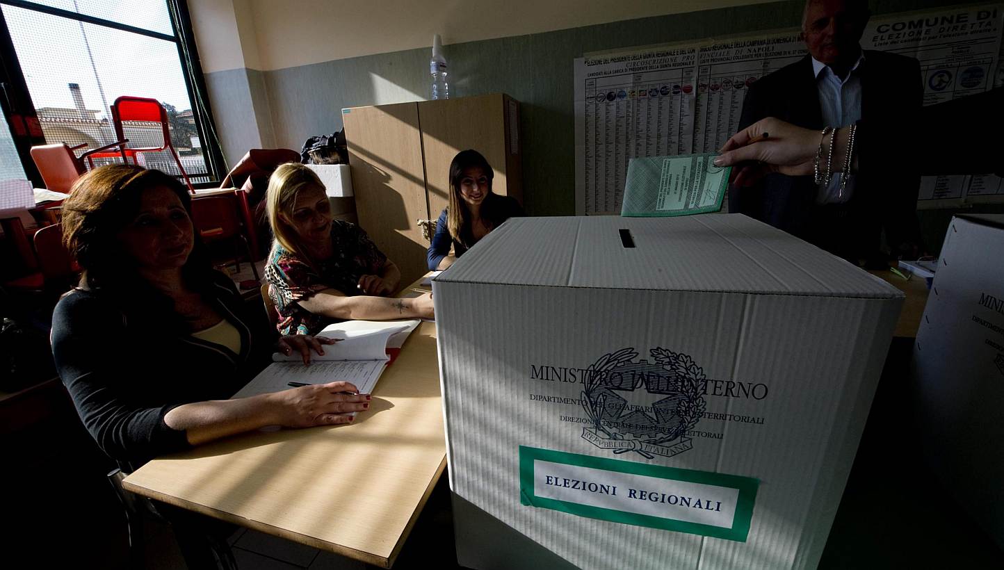 A person casts a vote during regional and municipal elections, at a polling station in Giugliano, near Naples, Italy, on May 31, 2015.&nbsp;Italians voted Sunday in regional elections seen as a key measure of the fading fortunes of ex-premier Silvio 