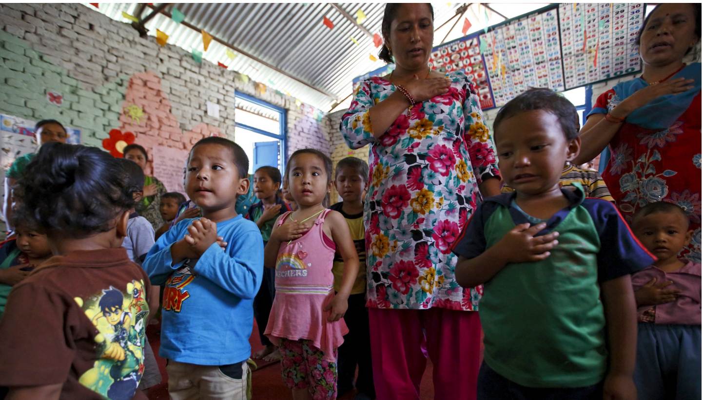 Children sing the national anthem as they start their class, a month after the April 25 earthquake, in Bhaktapur, Nepal on May 31, 2015.&nbsp;Thousands of children, many still traumatised from losing homes and loved ones, returned to class on Sunday 