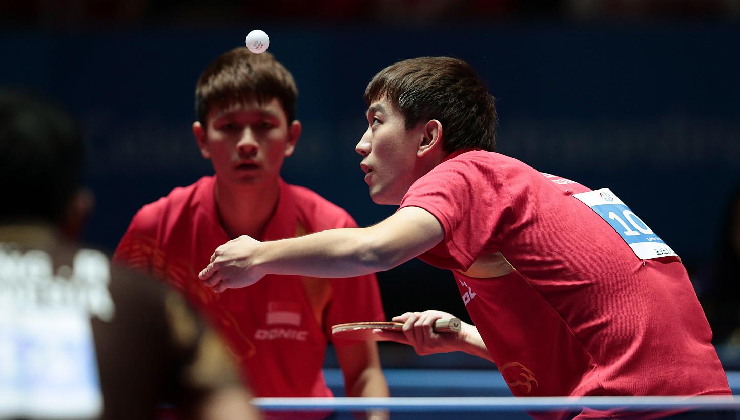 Singapore's Chen Feng (right) and Chew Zhe Yu Clarence in action at the SEA Games 2015. The Republic paddlers are on course for all-Singapore finals in both the SEA Games men's and women's doubles competitions, as all four pairings progressed into se