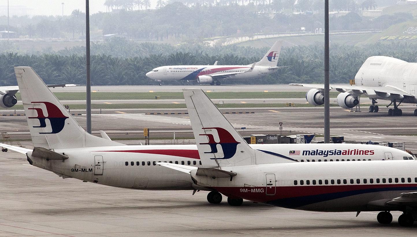 Malaysia Airlines planes are seen at Kuala Lumpur International Airport in Sepang, Selangor, Malaysia, on April 3, 2014. -- PHOTO: EPA