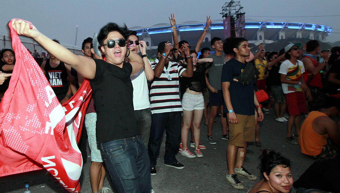 Concert-goers at the Bukit Jalil National Stadium in Kuala Lumpur, Malaysia, the venue for Future Music Festival Asia 2014. The three-day music festival was abruptly cancelled on its final night on March 15, 2014 following six drug-related deaths. --