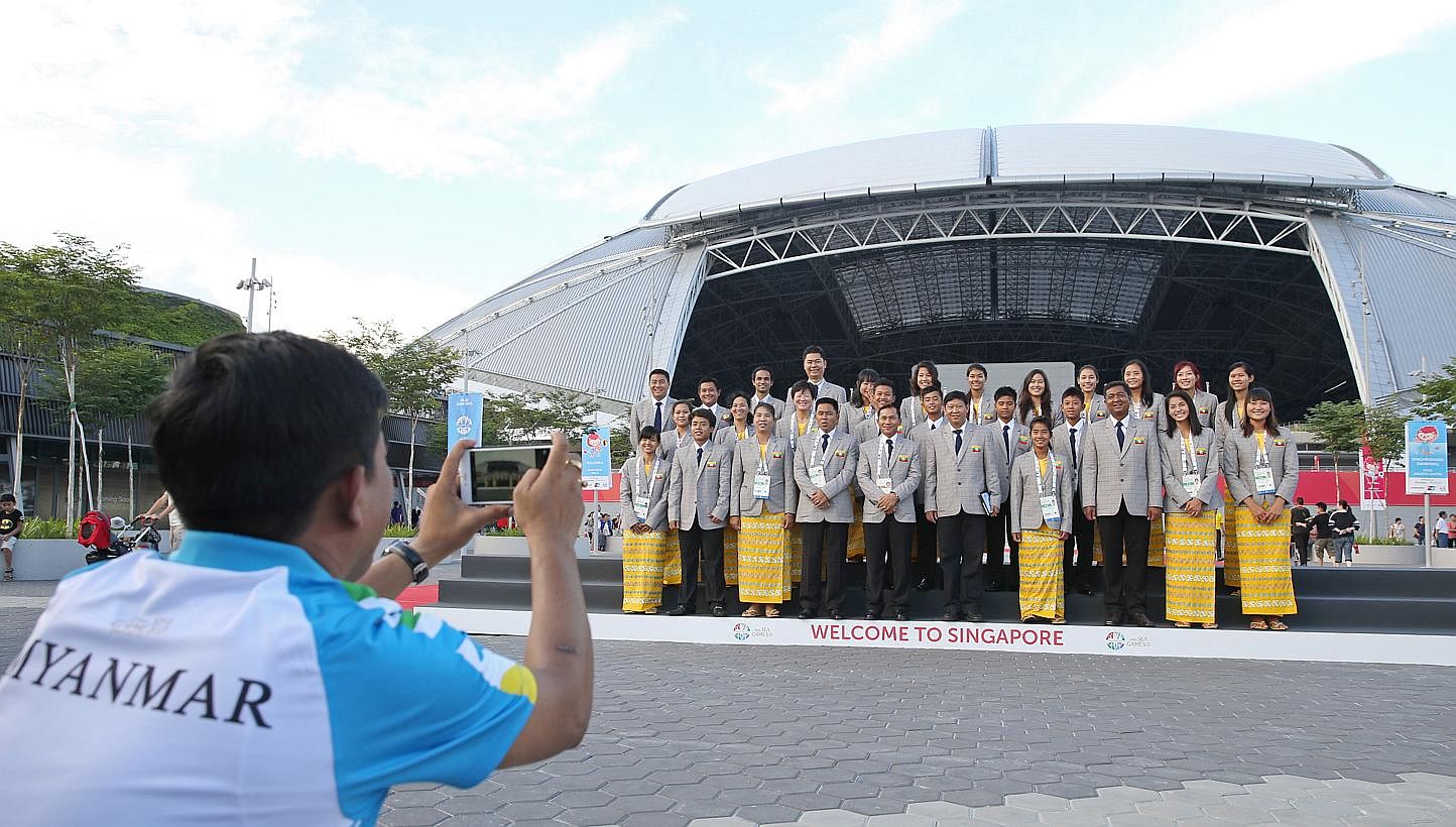 Officials and athletes of Myanmar participating in the 28th SEA Games 2015, take a photo outside the National Stadium in Singapore after a flag-raising ceremony on June 1, 2015. -- ST PHOTO: SEAH KWANG PENG