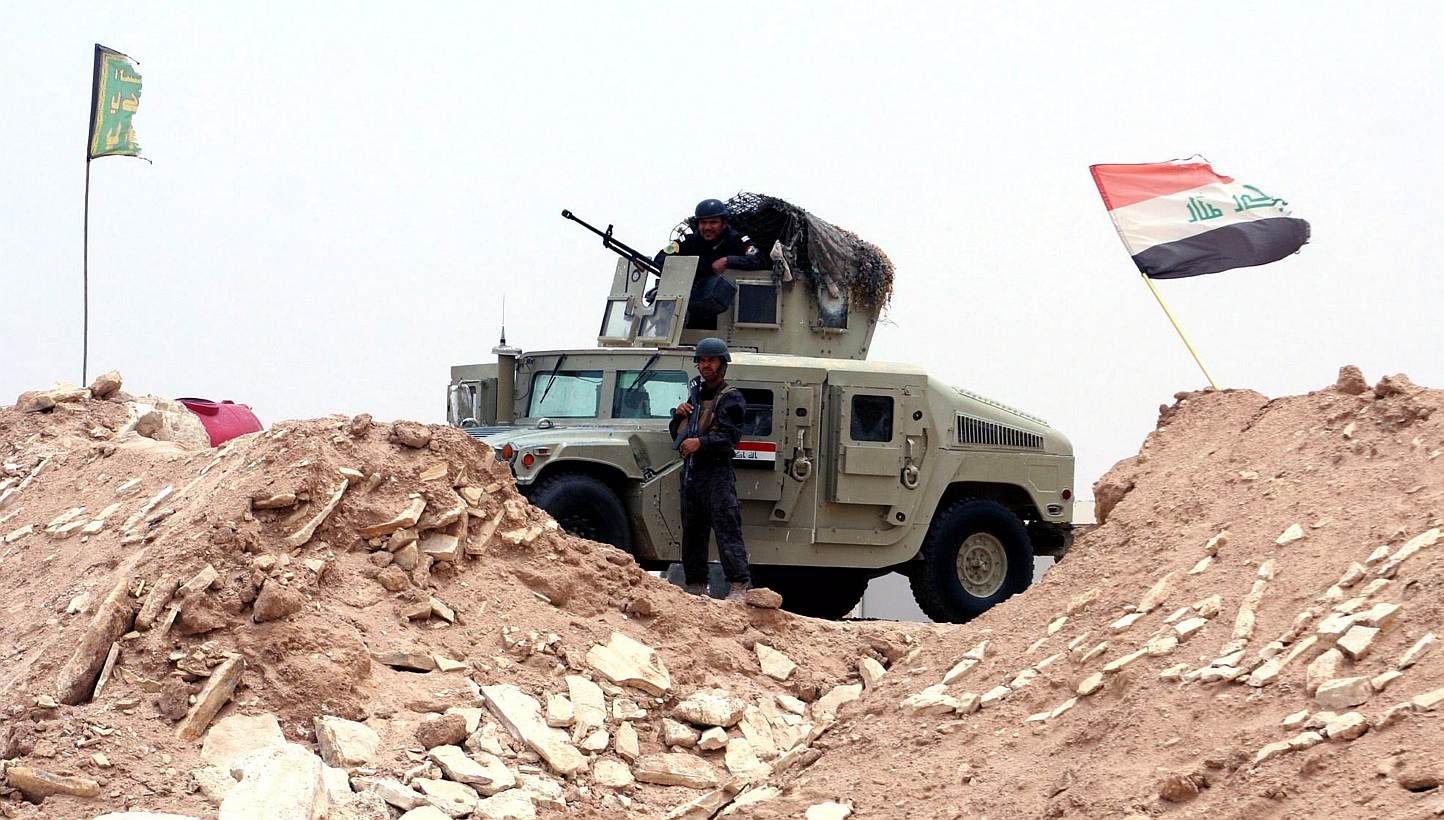 An Iraqi soldier stands guard at a military barracks near Ramadi city, western Iraq, on June 1, 2015.&nbsp;A suicide attack using an armoured vehicle packed with explosives against an Iraqi police base north-west of Baghdad killed at least 37 people 