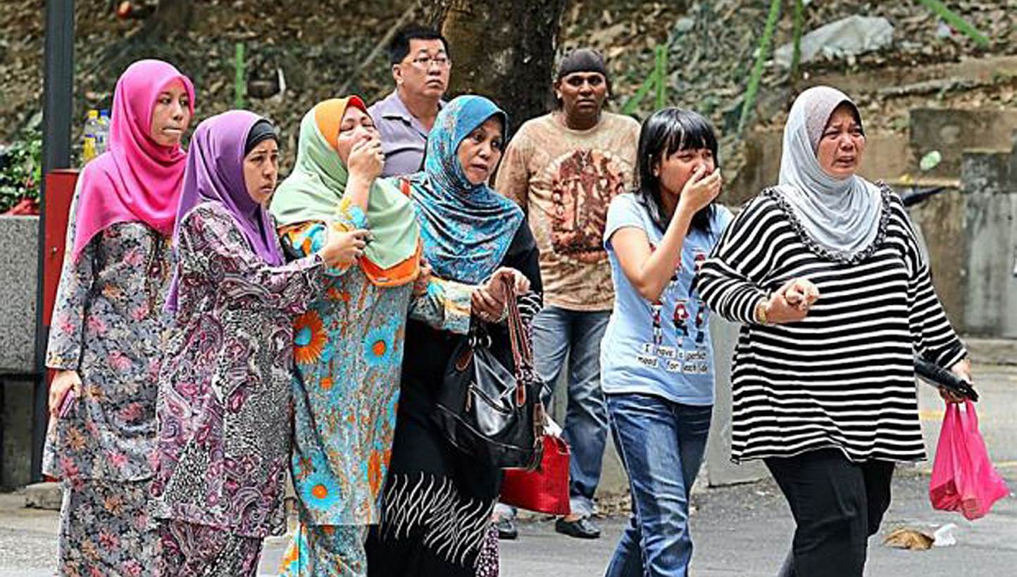 Family members of the six Malaysian concertgoers of the Future Music Festival Asia 2014 in Kuala Lumpur, who died from an apparent overdose of drugs. The pathologist involved in the autopsies say that the victims died of heatstroke and not drug overd