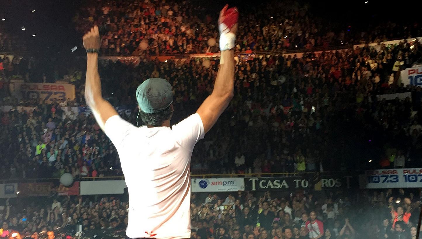 Spanish singer Enrique Iglesias performing on stage with a bloodied T-shirt covering his hand after suffering an accident with a drone on his right hand, during a concert in Tijuana, Mexico on Saturday night (May 30). Iglesias suffered several cuts o