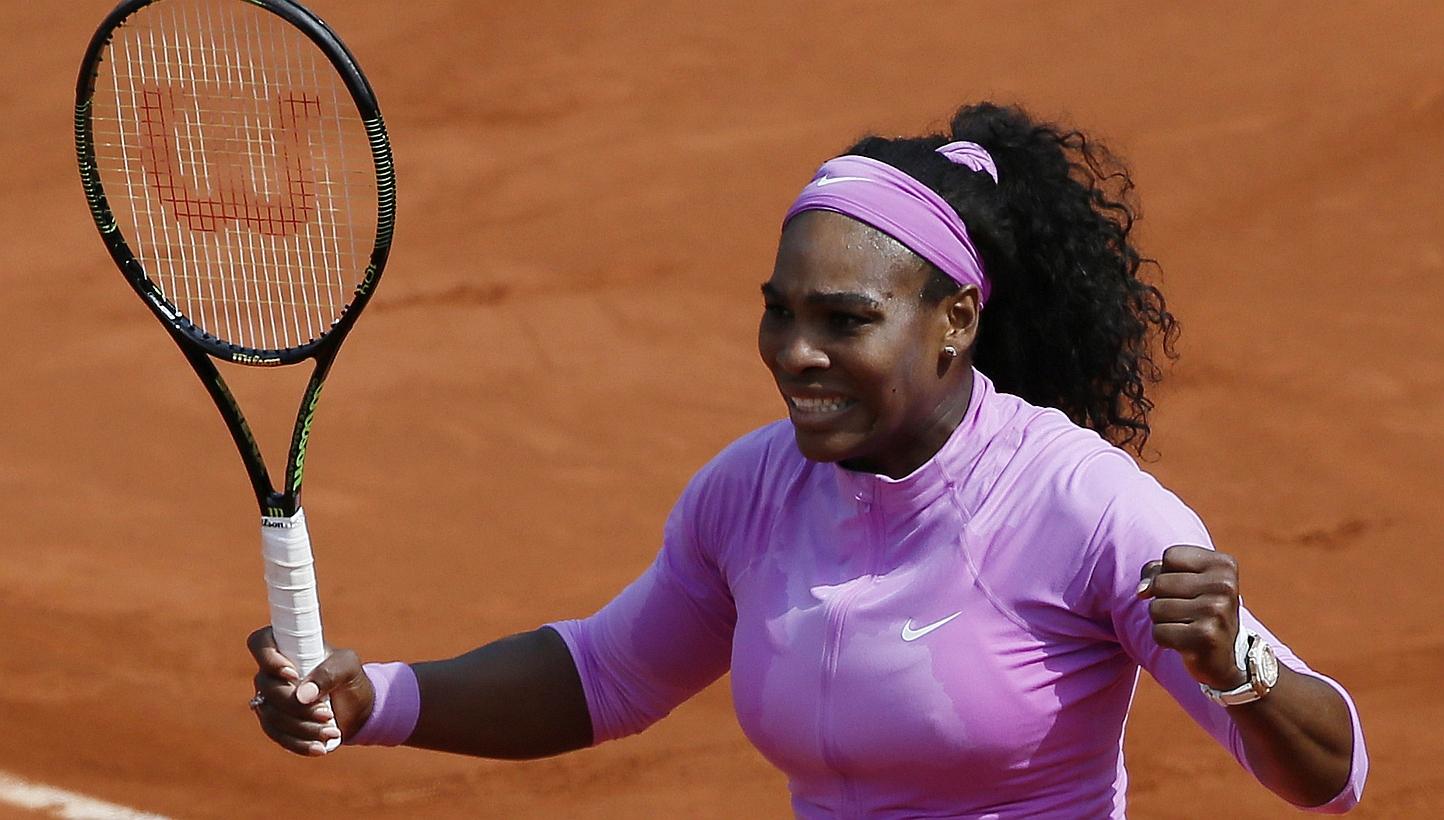 US player Serena Williams celebrates after winning her match against fellow American Sloane Stephens during the women's fourth round of the Roland Garros 2015 French Tennis Open in Paris on Monday (June 1). -- PHOTO: AFP&nbsp;