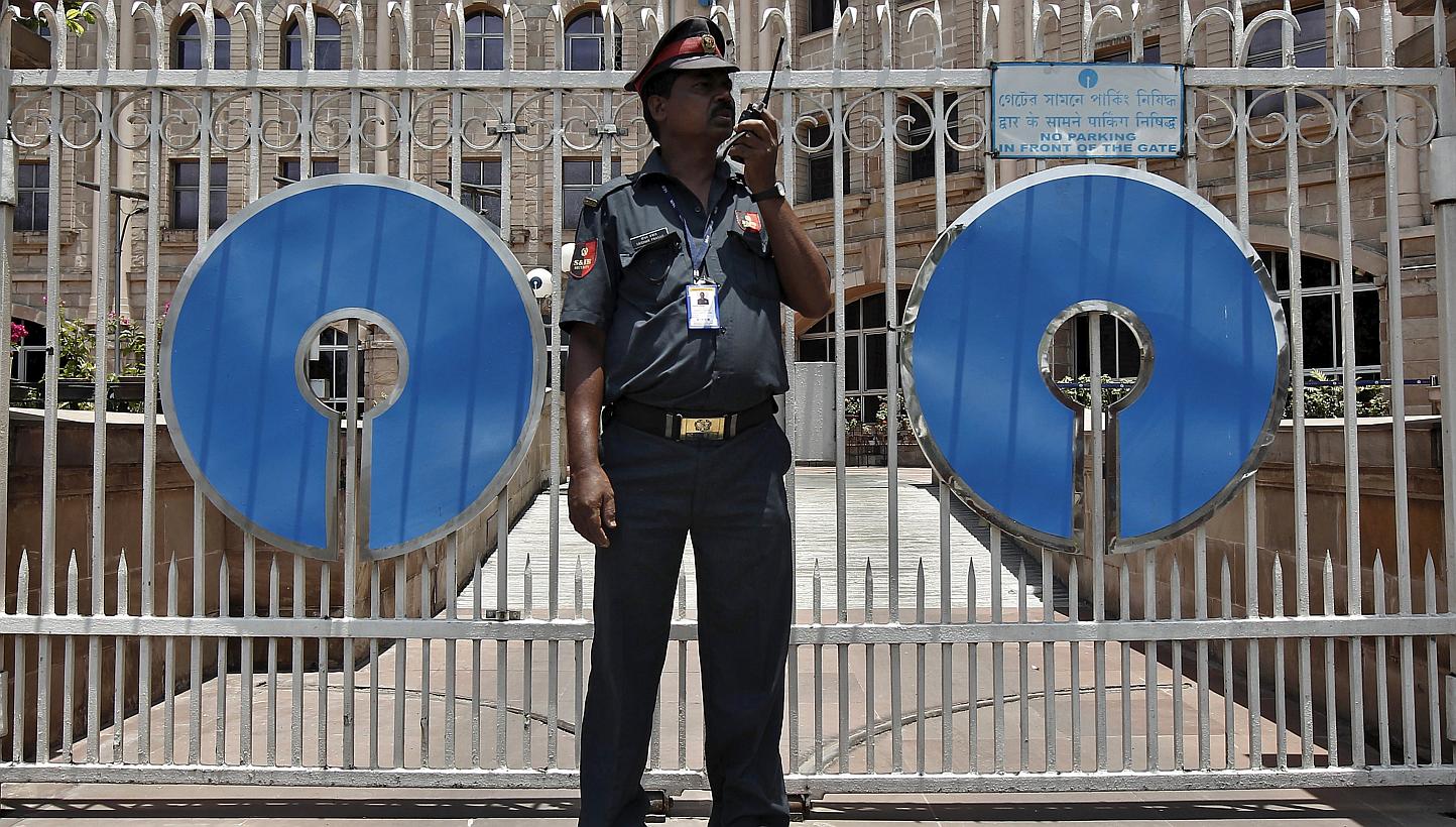 A security guard stands in front of the gate of the State Bank of India (SBI) regional office in Kolkata in this May 23, 2014 file photograph. -- PHOTO: REUTERS&nbsp;