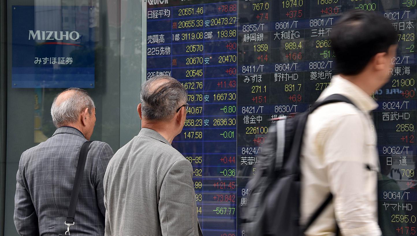 Most Asian stocks advanced as the yen held near a 12-year low against the US dollar after data showed growth in US manufacturing. -- PHOTO: AFP