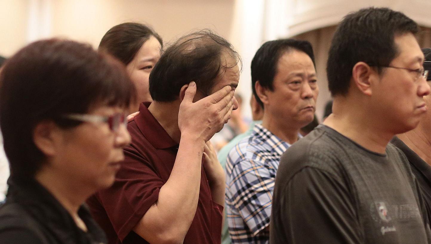 Relatives of passengers on board the Dongfangzhixing or "Eastern Star" which sank en route from Nanjing to Chongqing, react as they wait for information at a hotel in Nanjing, Jiangsu province on June 2, 2015. Family members of some of the passengers