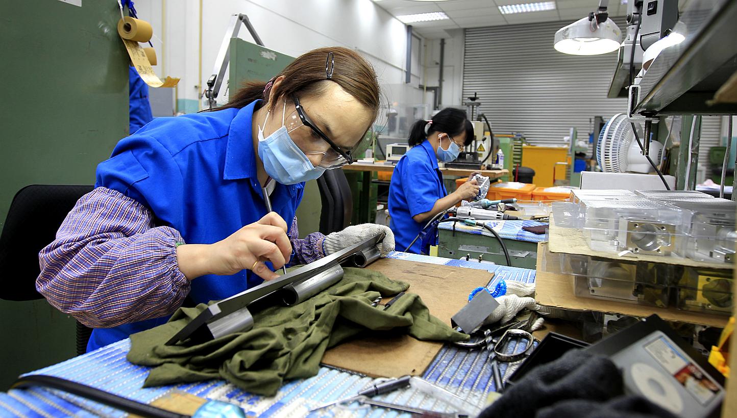 Singapore's manufacturing sector showed some signs of recovery as activity expanded for the first time this year, raising hopes for brighter outlook ahead. -- PHOTO: BUSINESS TIMES&nbsp;