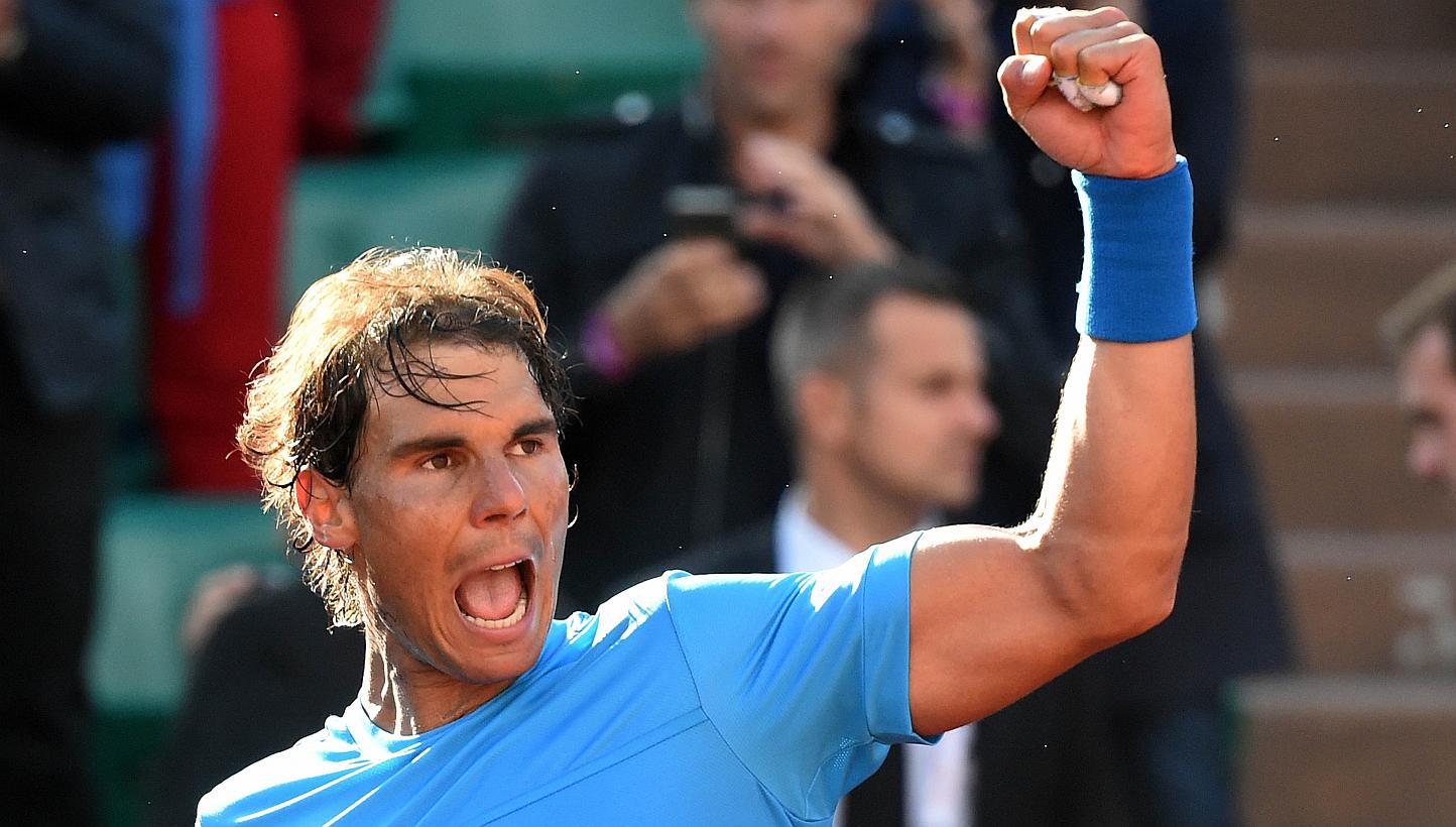 Spain's Rafael Nadal celebrates his victory over Jack Sock of the US at the end of their men's fourth round of the Roland Garros 2015 French Tennis Open in Paris on June 1, 2015. Nadal believes all the pressure will be on Novak Djokovic in Wedne