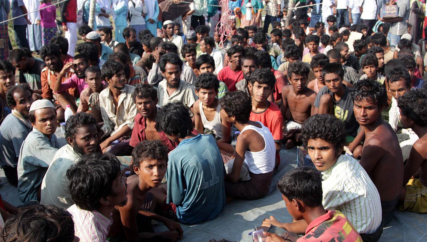 Refugees from Myanmar and Bangladesh are seen in a camp after their rescue by Aceh fisherman in Julok, East Aceh, Sumatra, Indonesia, on May 20, 2015. - PHOTO: AFP