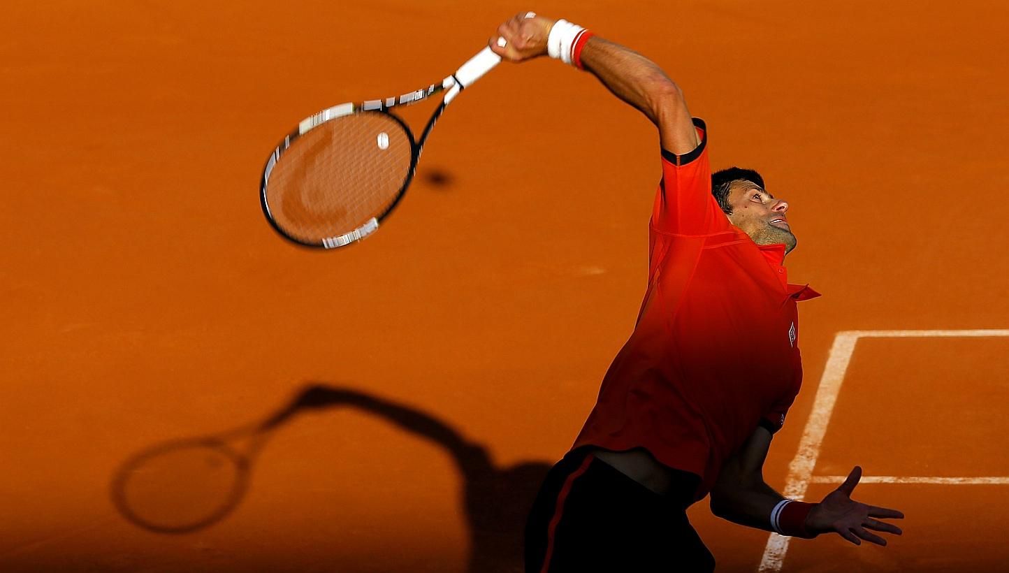 Novak Djokovic of Serbia in action against Richard Gasquet of France during their fourth round match for the French Open tennis tournament at Roland Garros in Paris on Monday (June 1). -- PHOTO: EPA