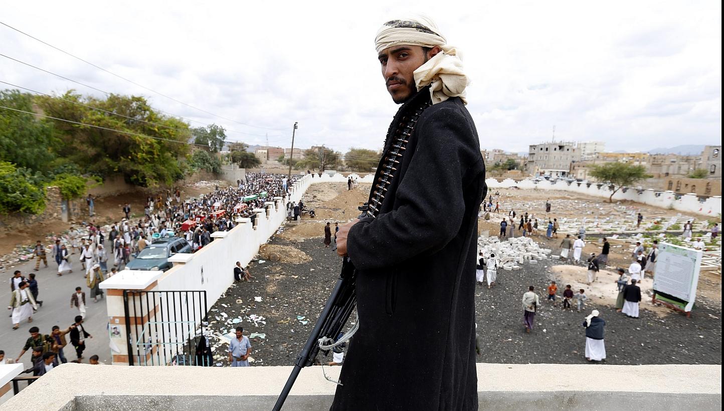 A member of Houthi militia looks on as Houthi supporters carry the coffins of comrades killed allegedly in an airstrike carried out by the Saudi-led coalition on a Houthi position in Sana’a, Yemen, -- PHOTO: EPA