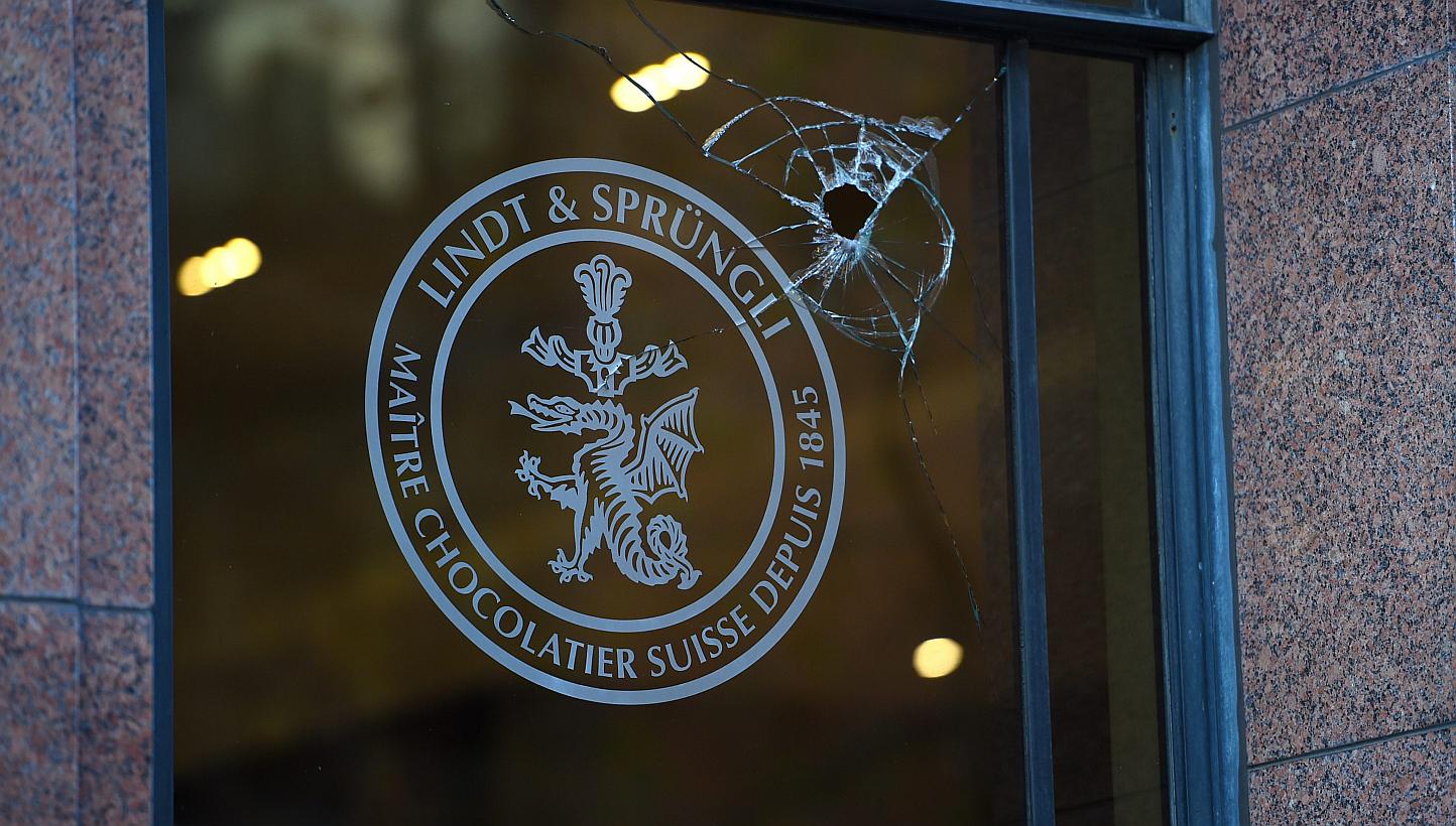 The Sydney cafe at the centre of a deadly siege has been vandalised with police investigating on Wednesday after rocks were thrown through five of its windows. -- PHOTO: EPA