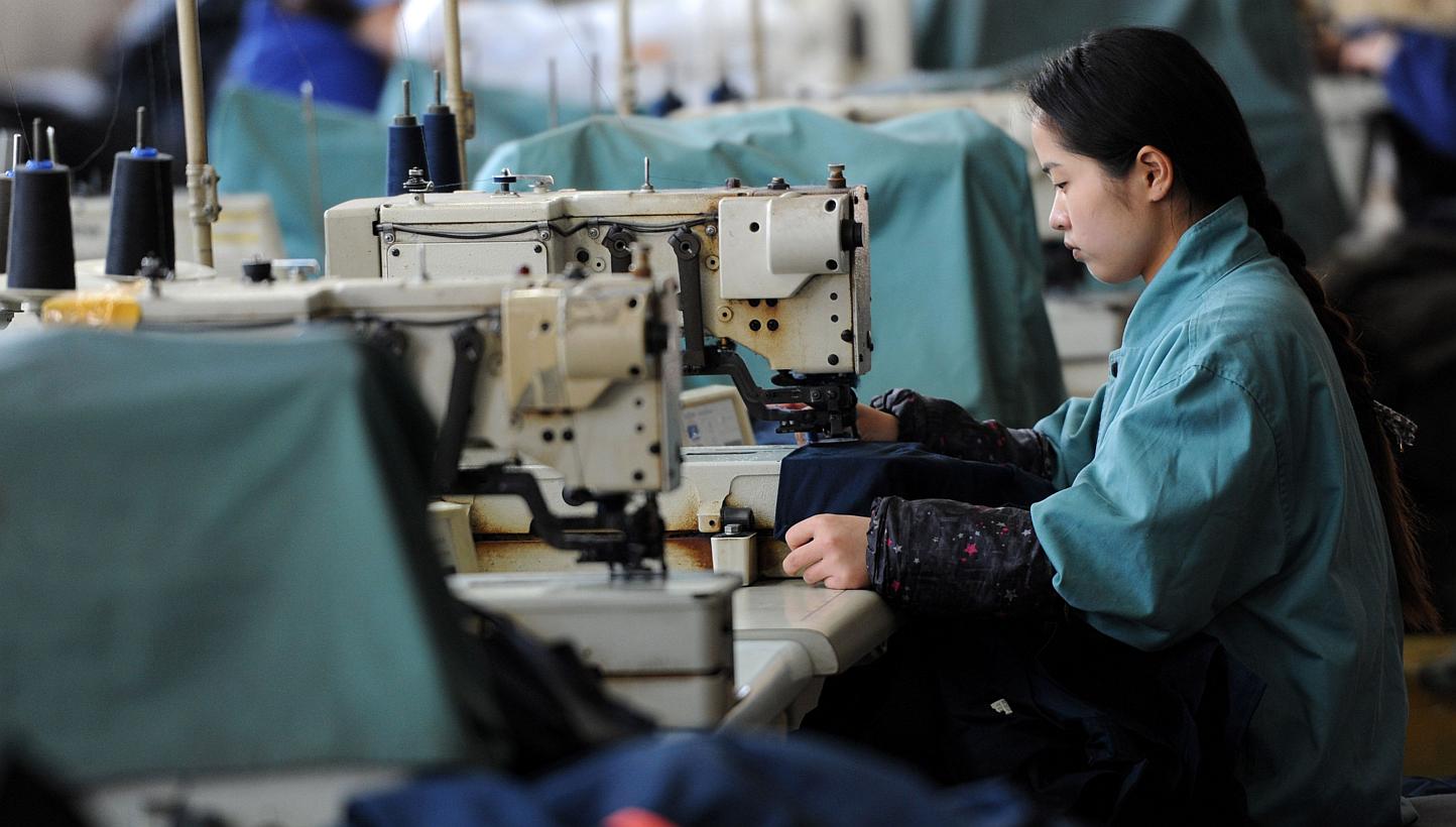 A factory worker in Huaibei, east China's Anhui province. -- PHOTO: AFP 