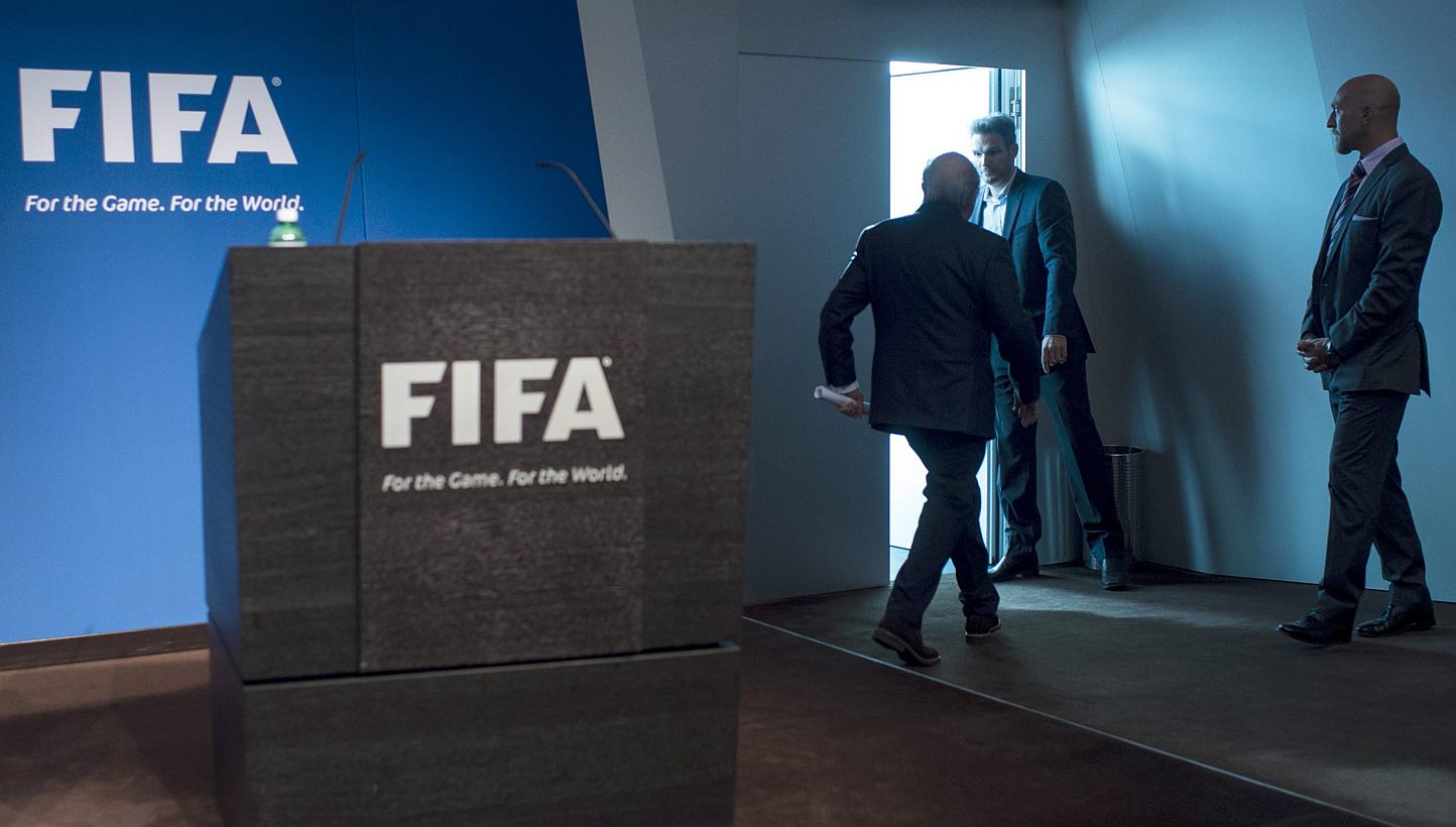 Fifa president Joseph S. Blatter (centre) leaves after speaking at a press conference at the Fifa headquarters in Zurich, Switzerland, on June 2, 2015. -- PHOTO: EPA