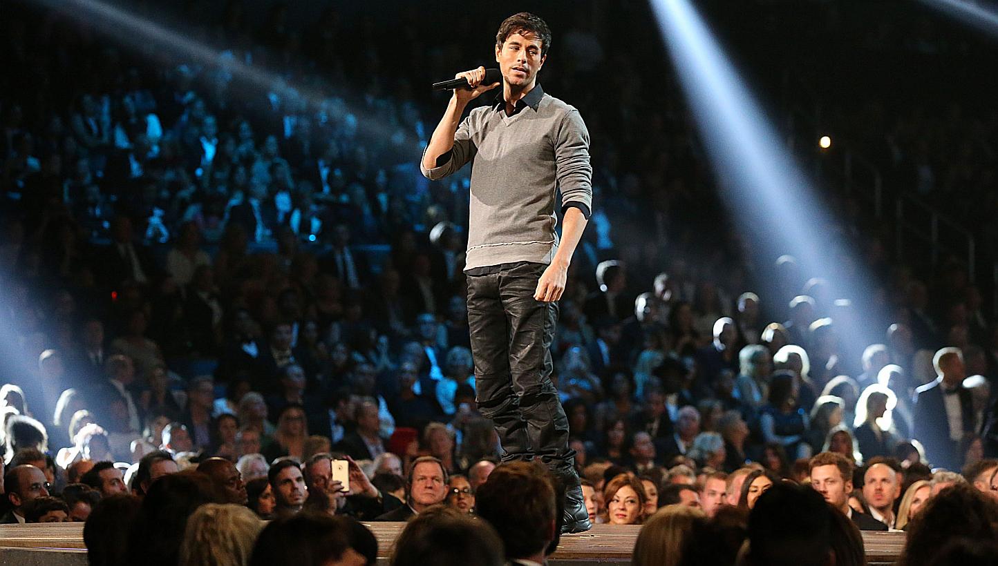 Enrique Iglesias performing at the 57th Annual Grammy at the Staples Center in Los Angeles on Feb 8, 2015. Iglesias will need weeks to recover after injuries suffered from a drone during a concert turned out to be worse than feared. -- PHOTO: AFP&nbs