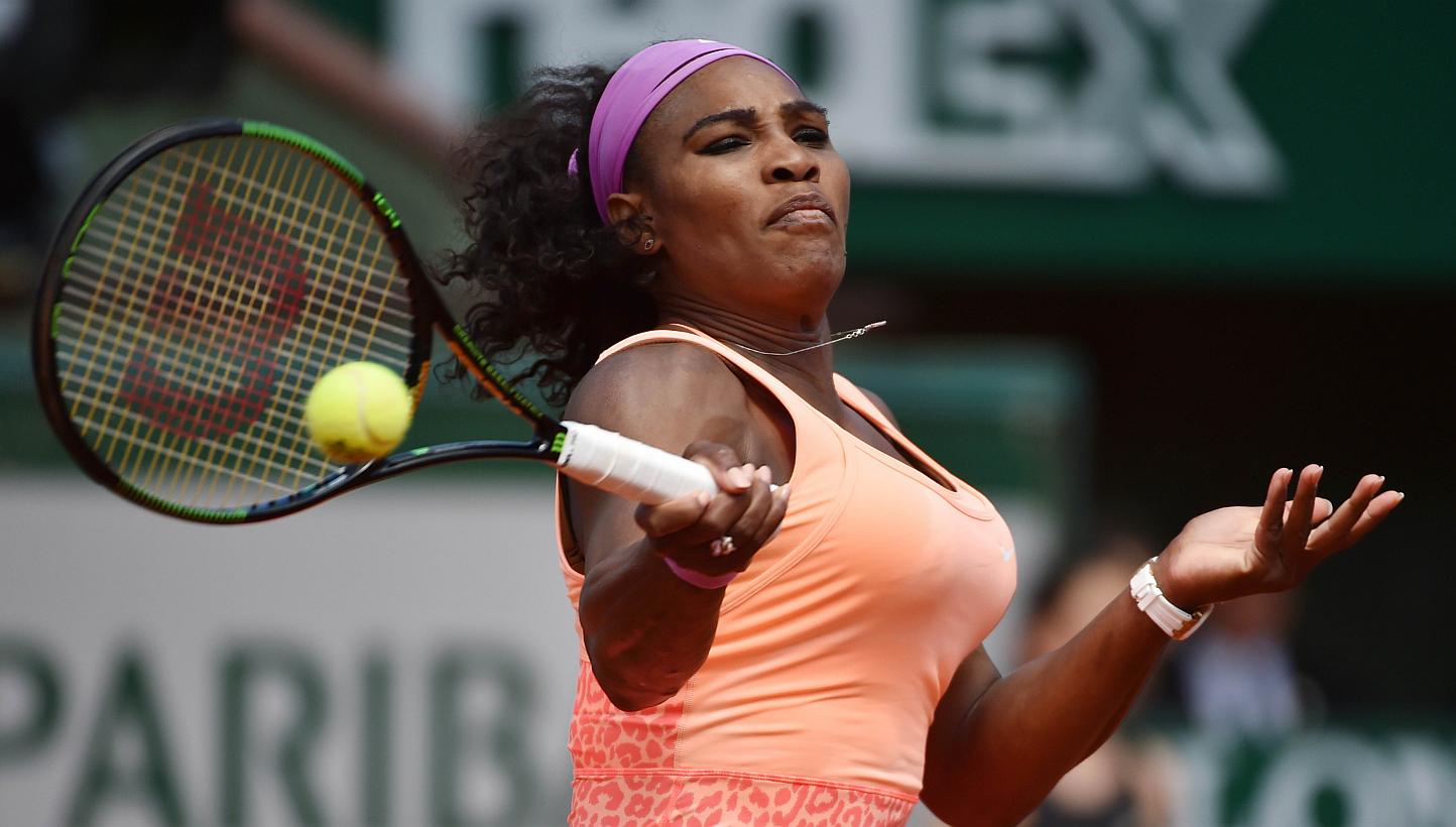 Serena Williams returns to Italy's Sara Errani during their women's quarter final match of the Roland Garros 2015 French Tennis Open in Paris on June 3, 2015. -- PHOTO: AFP