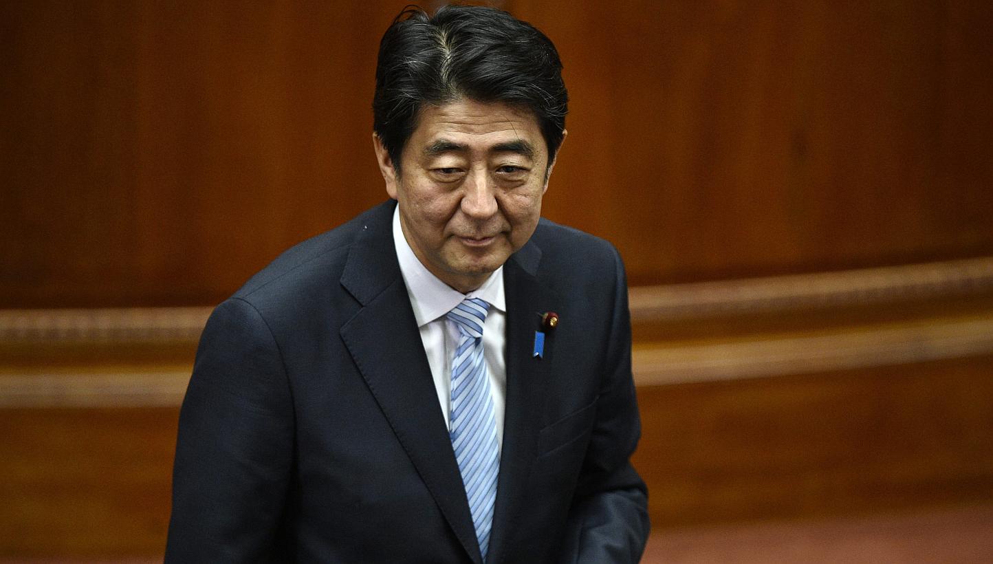 Japanese Prime Minister Shinzo Abe's ruling party called for a "cautious response" to the China-led Asian Infrastructure Investment Bank (AIIB), but will leave the decision on joining to the premier, a draft report shows on Wednesday. -- PHOTO: EPA