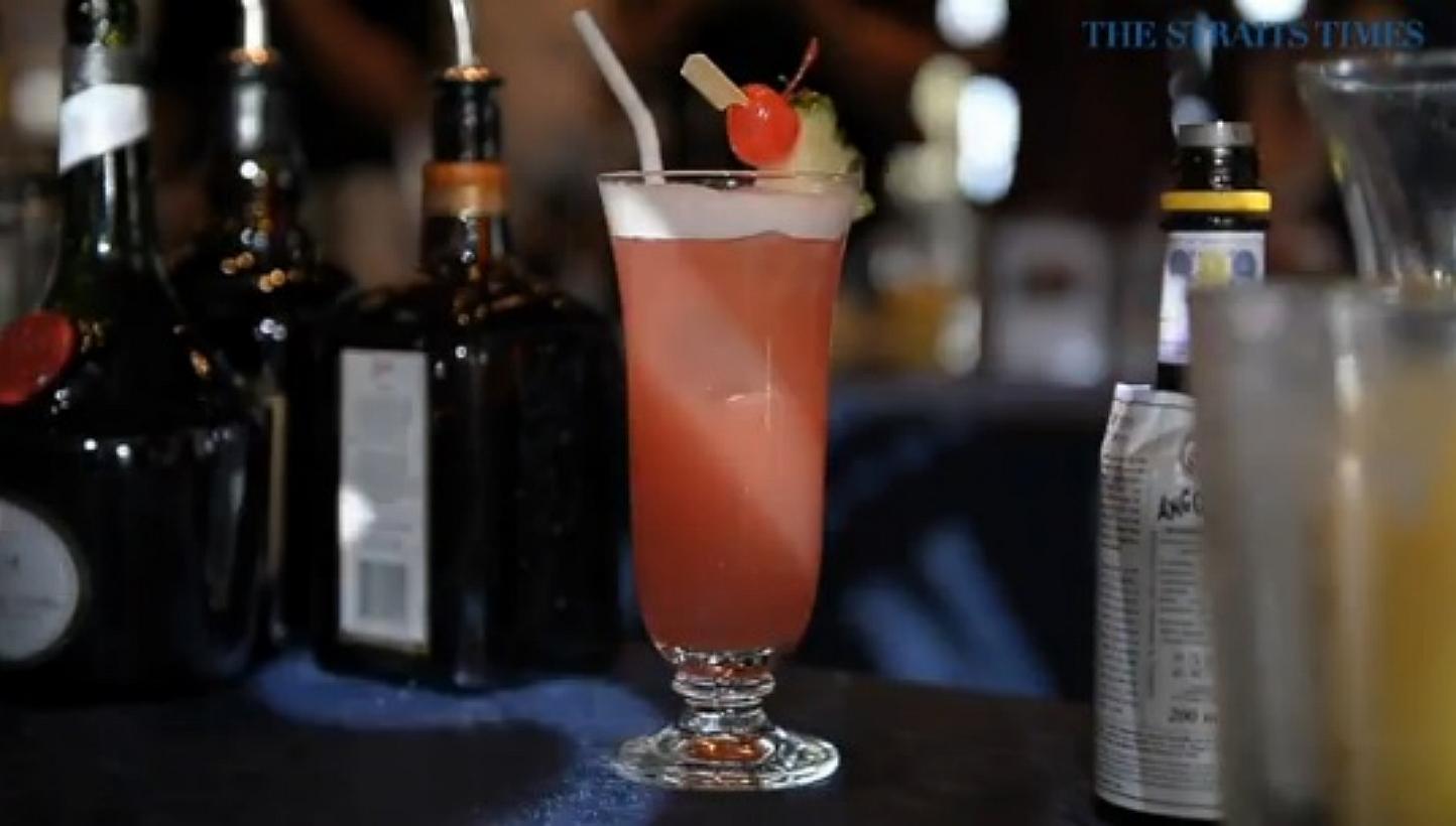 The Singapore Sling, a cocktail that was created at the Raffles Hotel in 1915, celebrates its centennial anniversary this year. -- PHOTO: SCREENGRAB FROM RAZORTV VIDEO
