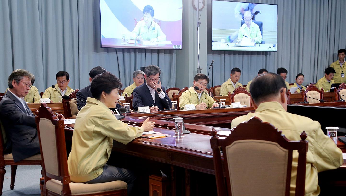 South Korean President Park Geun-hye (second left, front) presides over an emergency meeting at the presidential office Cheong Wa Dae in Seoul, South Korea on June 3, 2015. The meeting focused on measures to contain the Middle East Respiratory Syndro